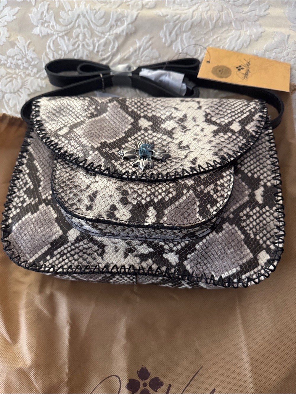 Patricia Nash Black and White Snake-Print Crossbody with Silver Concho